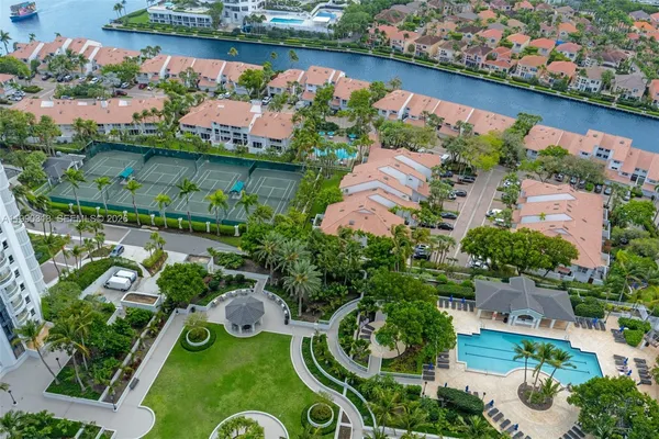 an aerial view of a house with a lake view