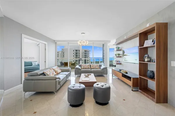 a living room with furniture and a large window