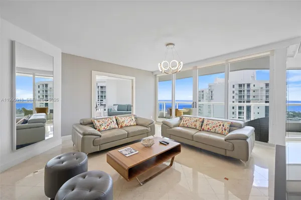 a living room with furniture and a large window