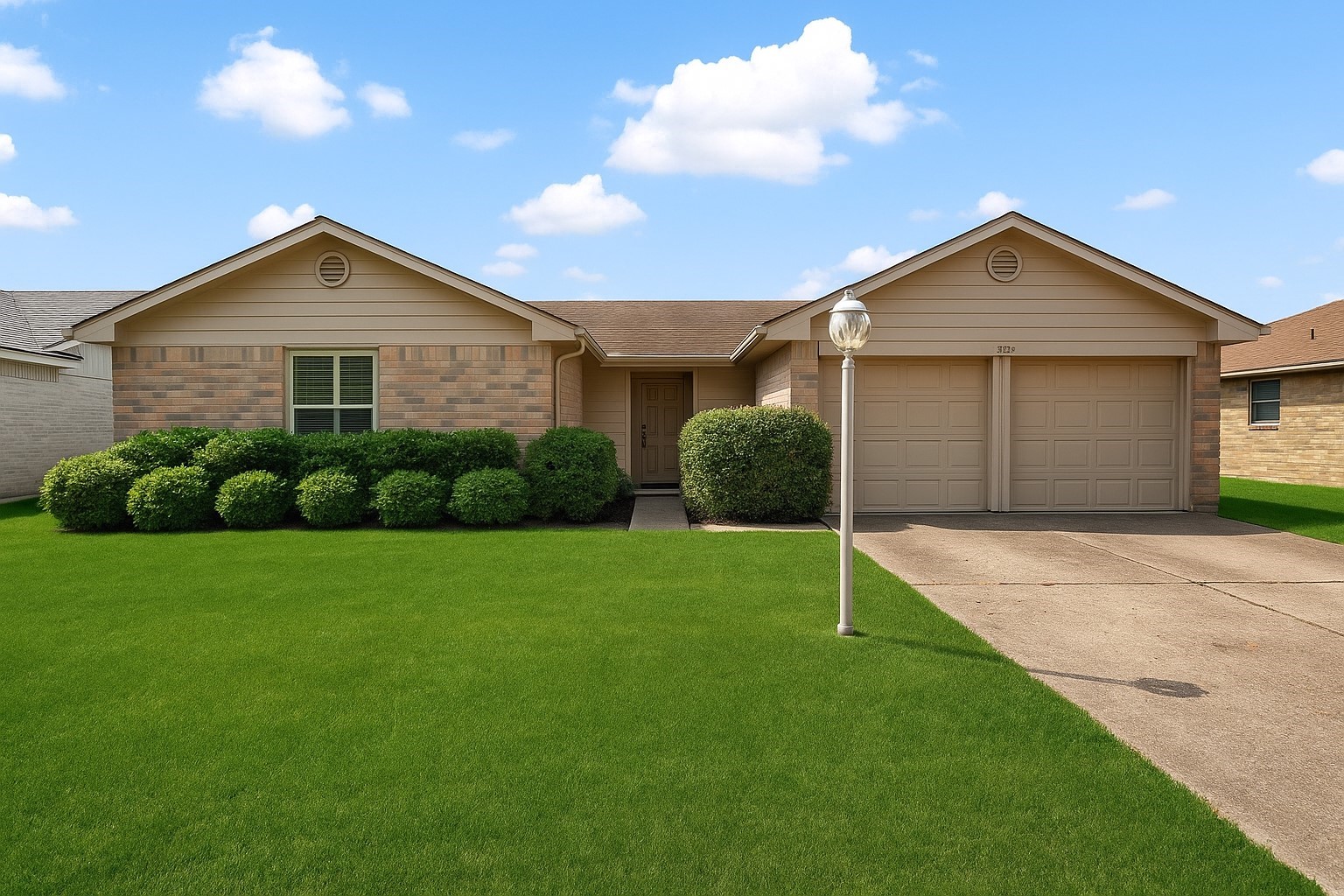 a view of a house with a yard and garage