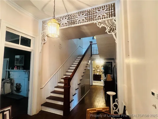 a view of front door and wooden floor