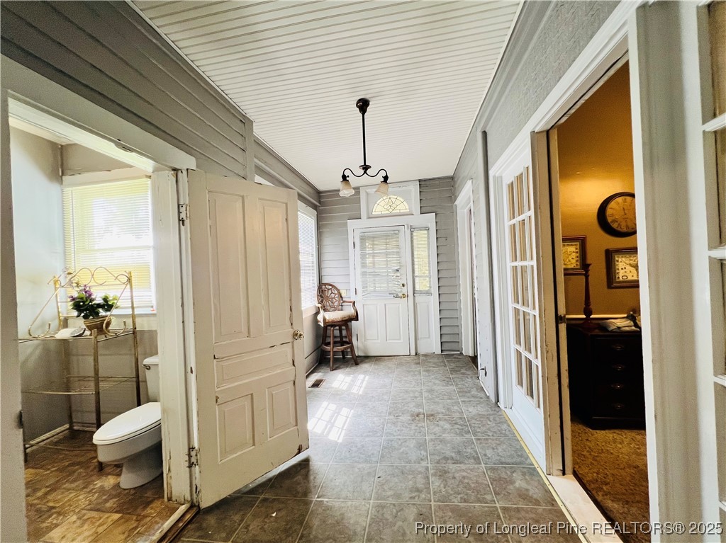 208 South Bond Street Rowland, NC 28383 - Photo 18 of 30 a view of a hallway with bathroom and glass door