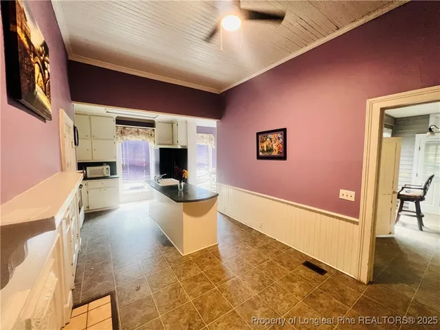 a view of living room with furniture and a fireplace