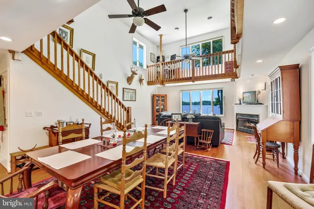 a living room with lots of furniture and a chandelier