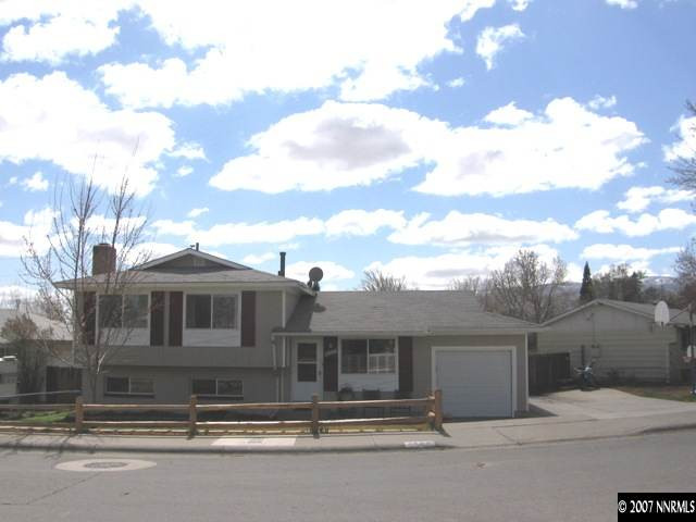 3560 Downey Avenue Reno, NV 89503 - Photo 1 of 9 a front view of a house with a yard