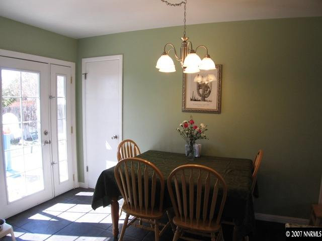 3560 Downey Avenue Reno, NV 89503 - Photo 3 of 9 a view of a dining room with furniture and chandelier