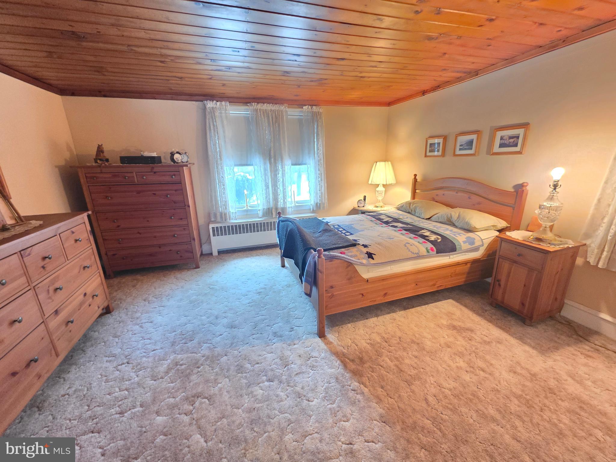 3016 County House Road Woodbury, NJ 08096 - Photo 12 of 19 a bed room with a bed and a dresser