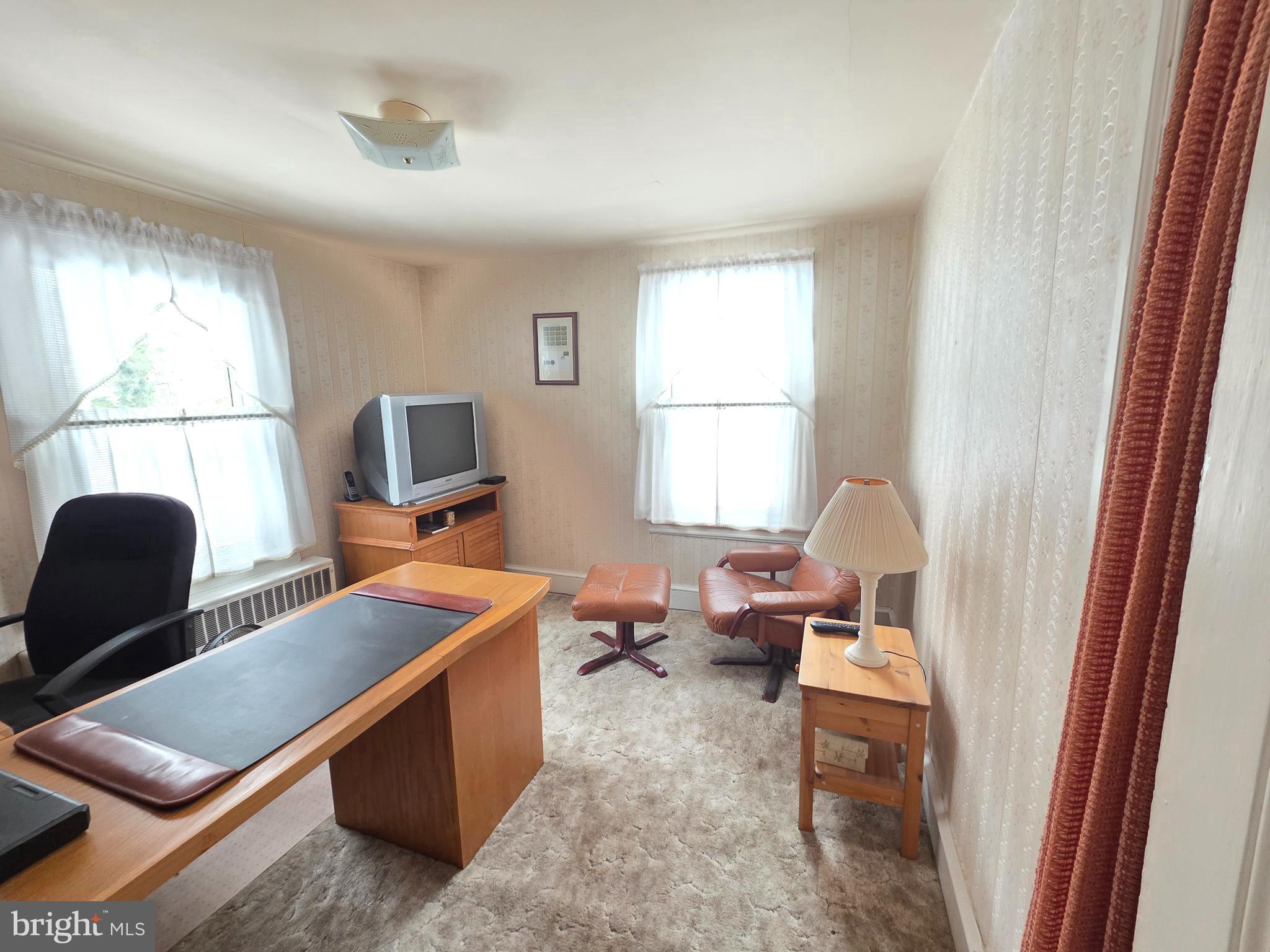 3016 County House Road Woodbury, NJ 08096 - Photo 17 of 19 a room with furniture a window and gym equipment