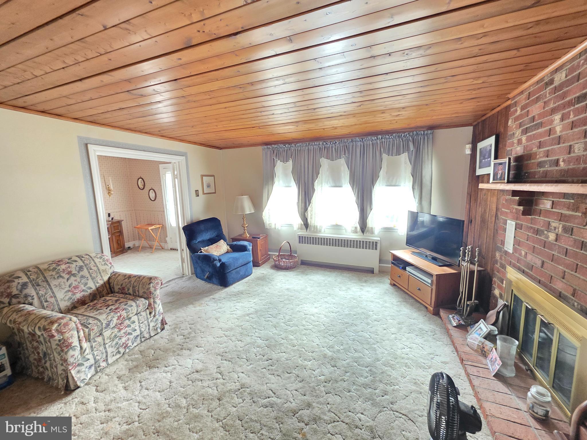 3016 County House Road Woodbury, NJ 08096 - Photo 2 of 19 a living room with furniture and a large window