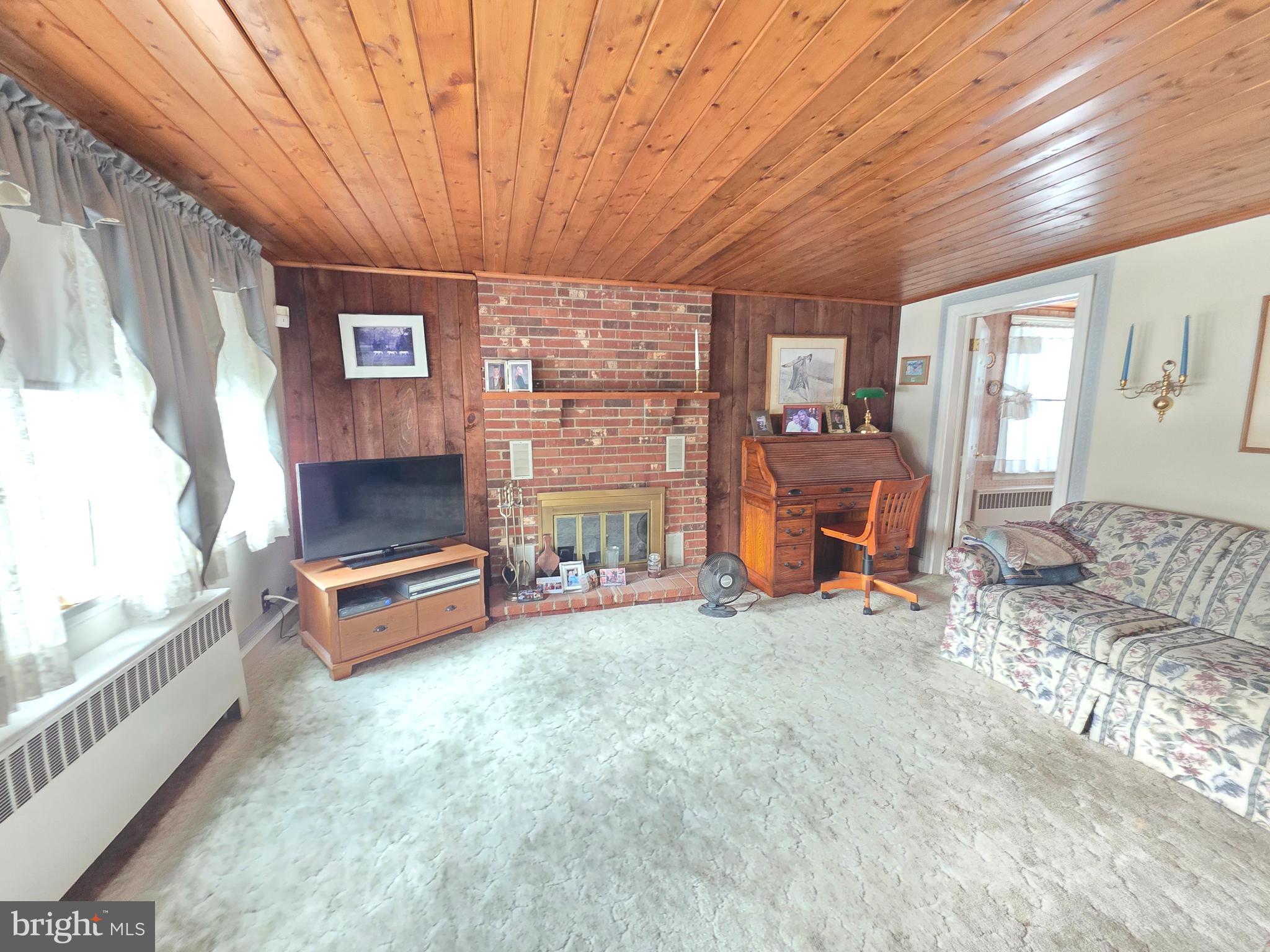 3016 County House Road Woodbury, NJ 08096 - Photo 3 of 19 a room with furniture and a fireplace