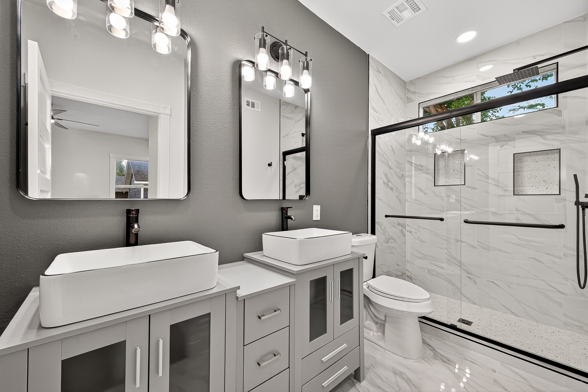 1705 Ovid Street Houston, TX 77007 - Photo 15 of 30 a bathroom with a double vanity sink mirror and toilet