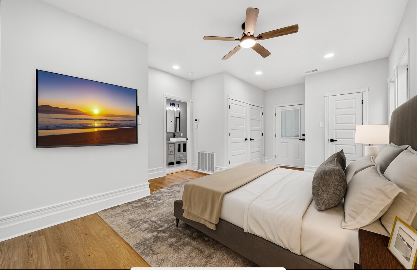 1705 Ovid Street Houston, TX 77007 - Photo 16 of 30 a bedroom with a bed and a flat screen tv