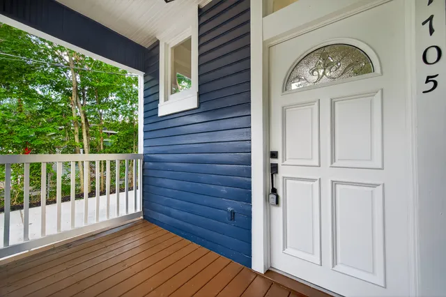 a view of front door with a wooden floor