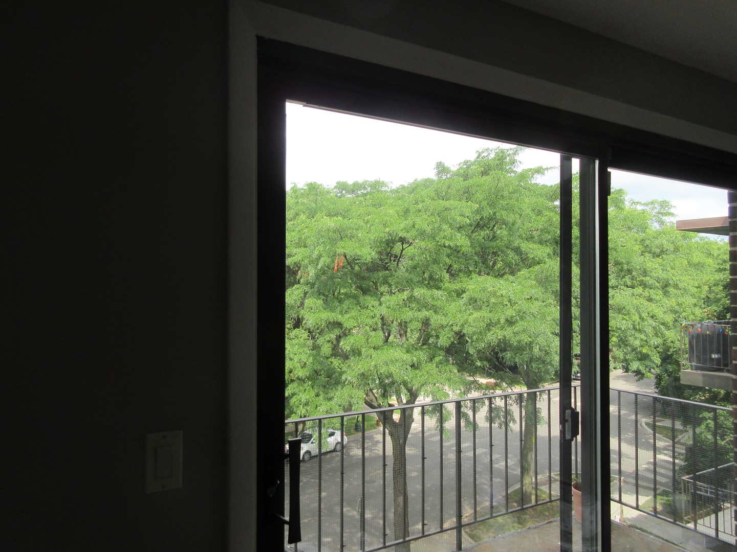 7255 North Ridge Boulevard, Unit 403 Chicago, IL 60645 - Photo 22 of 30 a view of a forest from a balcony
