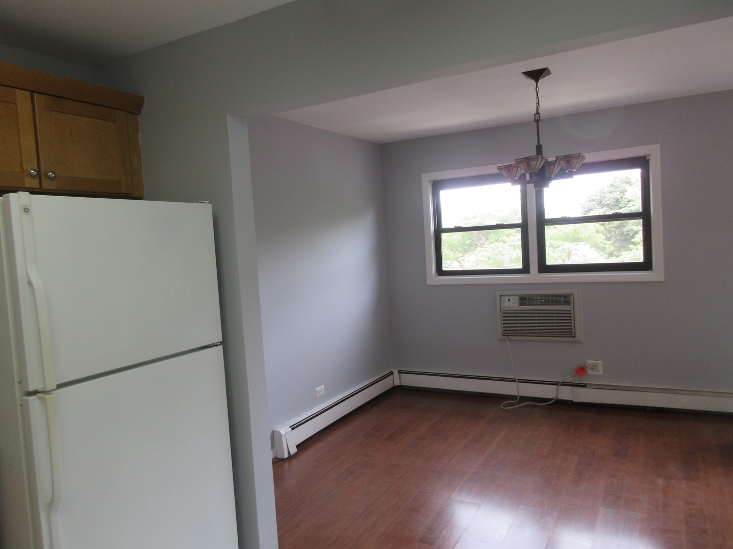 7255 North Ridge Boulevard, Unit 403 Chicago, IL 60645 - Photo 24 of 30 a view of empty room with wooden floor and window