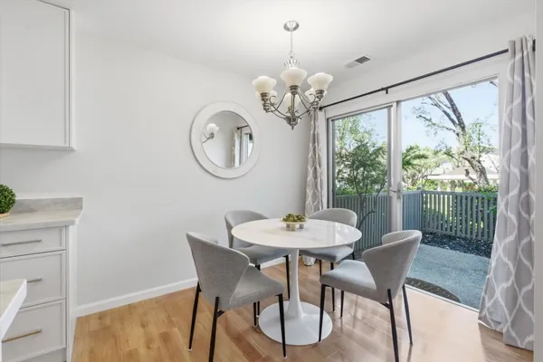 a view of a dining room with furniture window and outside view