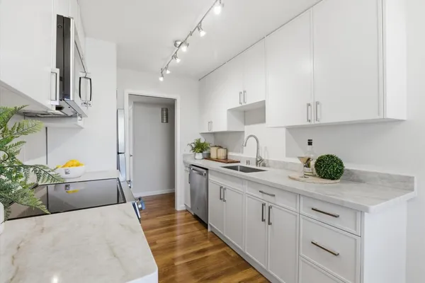 a kitchen with cabinets and window
