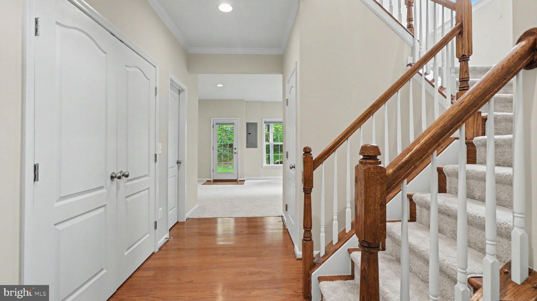 42371 Trellis Square Brambleton, VA 20148 - Photo 14 of 70 Inviting foyer with elegant staircase.