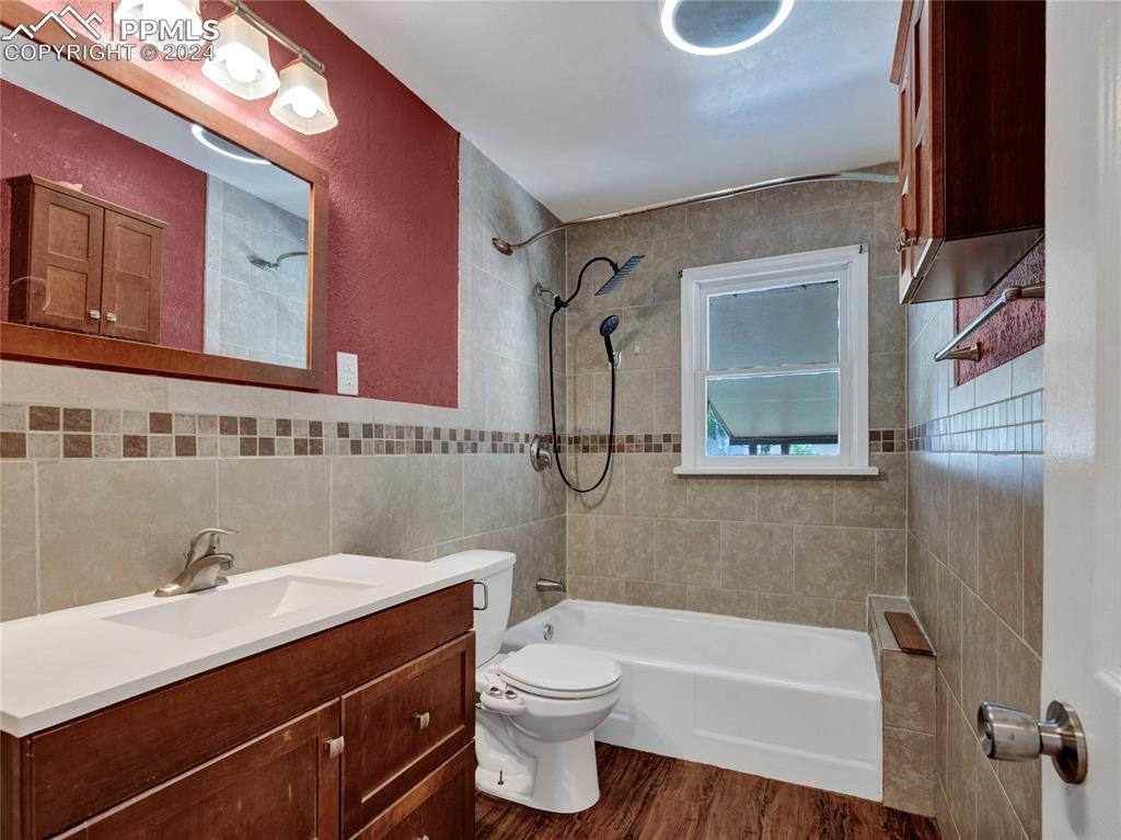 39 Duke Street Pueblo, CO 81005 - Photo 13 of 27 a bathroom with a sink a toilet and shower