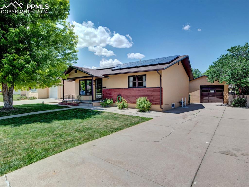 39 Duke Street Pueblo, CO 81005 - Photo 2 of 27 a front view of a house with garden