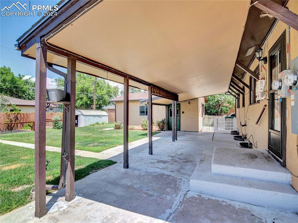 39 Duke Street Pueblo, CO 81005 - Photo 23 of 27 a view of a house with backyard and porch
