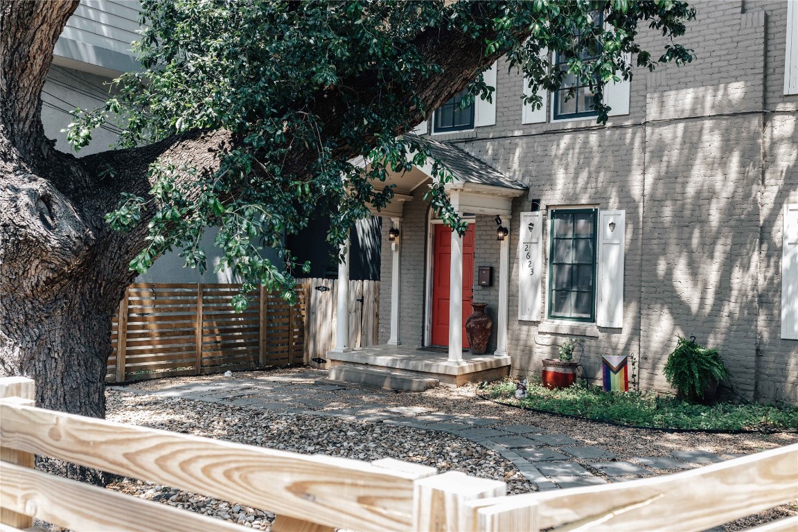 a view of a house with a small yard