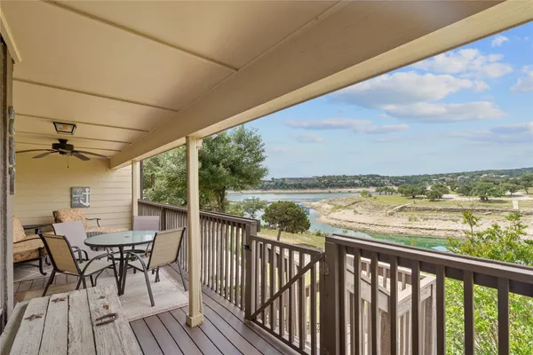 a view of a balcony with chairs
