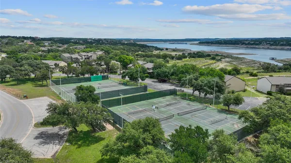 an aerial view of a houses with a yard