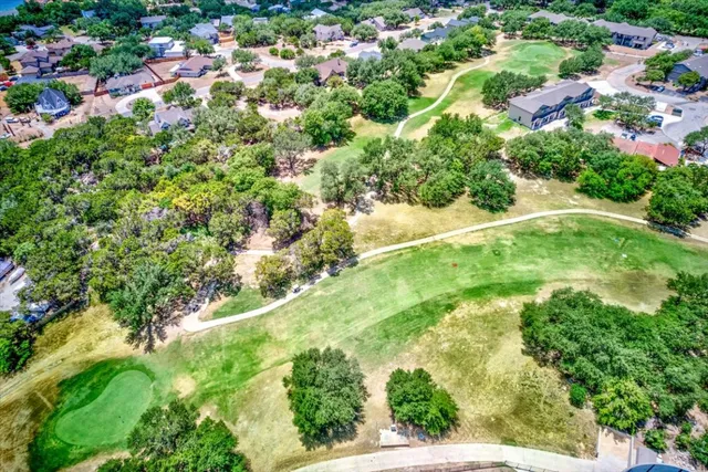 a view of a balcony with two chairs and a table