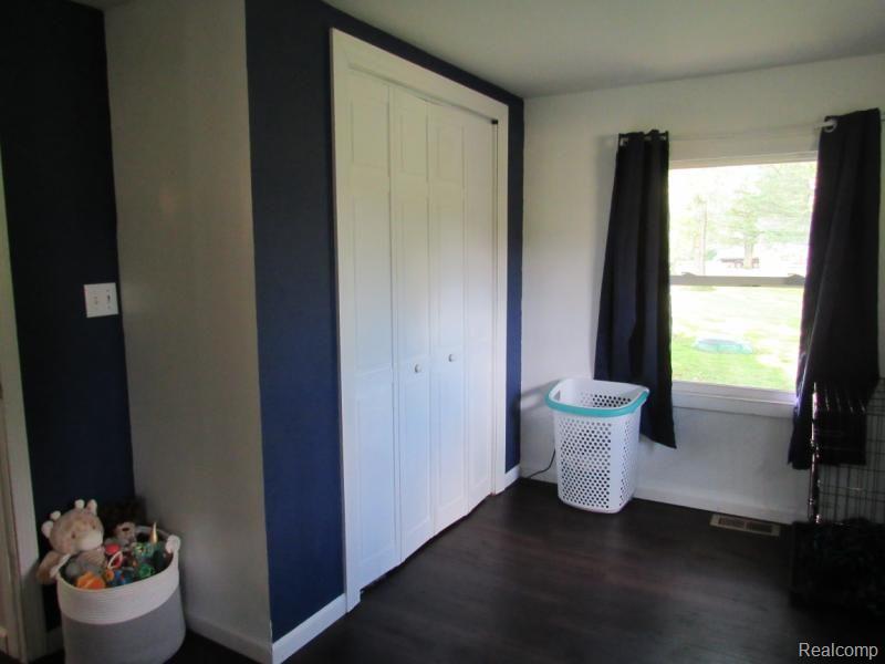 6020 Sheridan Road Vassar, MI 48768 - Photo 12 of 24 Closet in master bedroom. Crawl space access