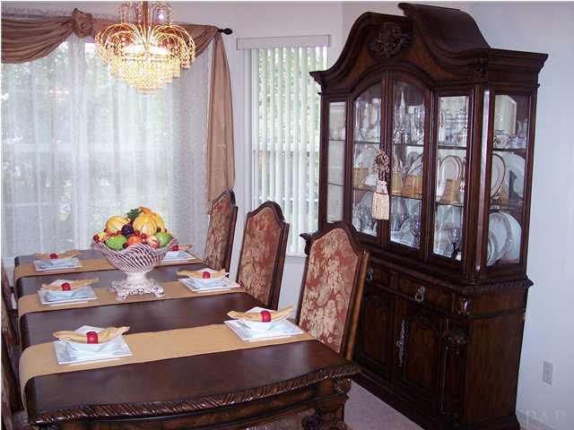 5037 Roland Road Pace, FL 32571 - Photo 5 of 24 Formal dining room is spacious enough for china cabinet.