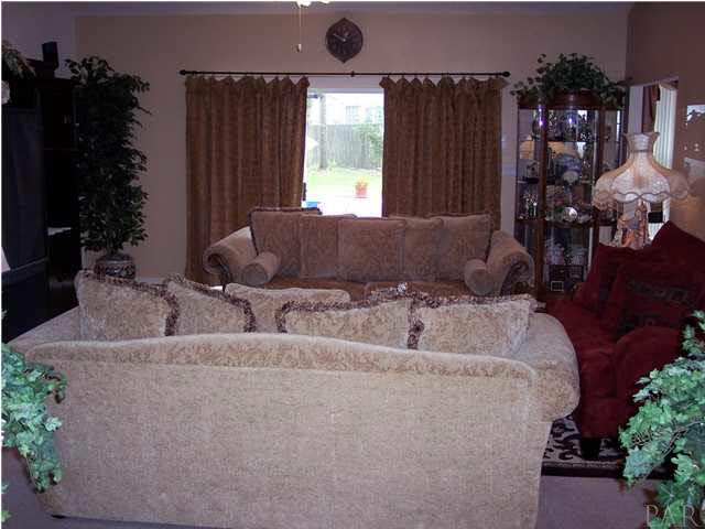 5037 Roland Road Pace, FL 32571 - Photo 6 of 24 Family room with 2 large windows and sliding glass door.