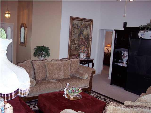 5037 Roland Road Pace, FL 32571 - Photo 7 of 24 Another view of family room. Foyer to left and hallway to 3 bedrooms and 2nd bathroom.