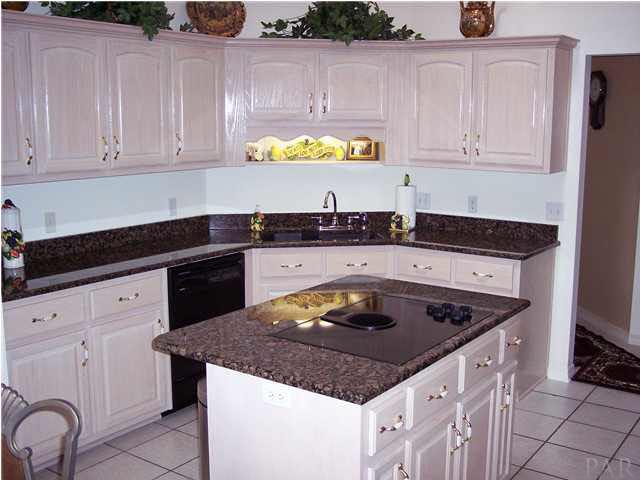 5037 Roland Road Pace, FL 32571 - Photo 10 of 24 You'll love all the cabinets even under the island.