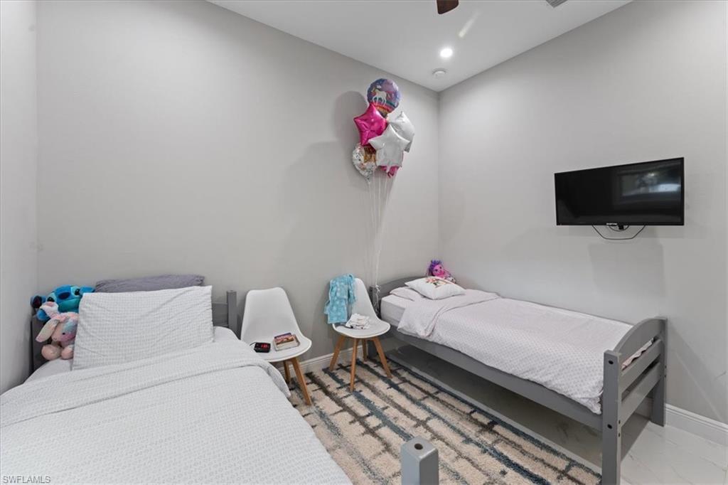 3219 64th Avenue Northeast Naples, FL 34120 - Photo 12 of 33 Bedroom featuring recessed lighting, a ceiling fan, and baseboards