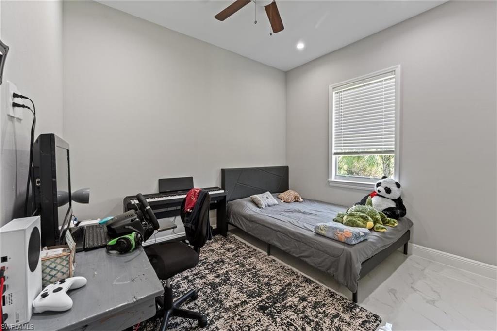 3219 64th Avenue Northeast Naples, FL 34120 - Photo 13 of 33 Bedroom with recessed lighting, baseboards, marble finish floor, and a ceiling fan