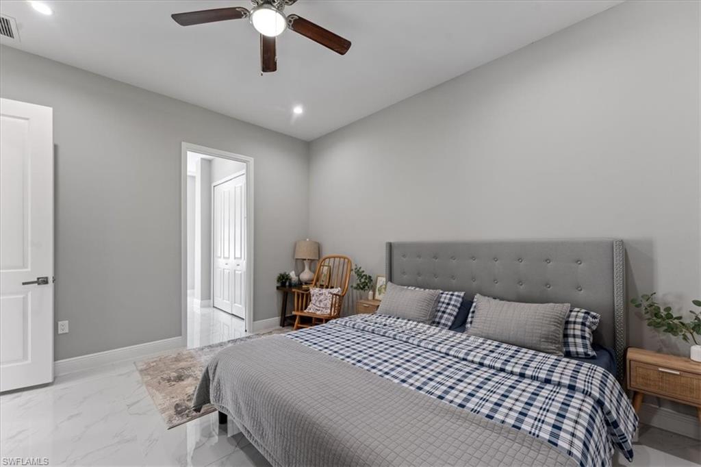 3219 64th Avenue Northeast Naples, FL 34120 - Photo 18 of 33 Bedroom with visible vents, recessed lighting, baseboards, and marble finish floor