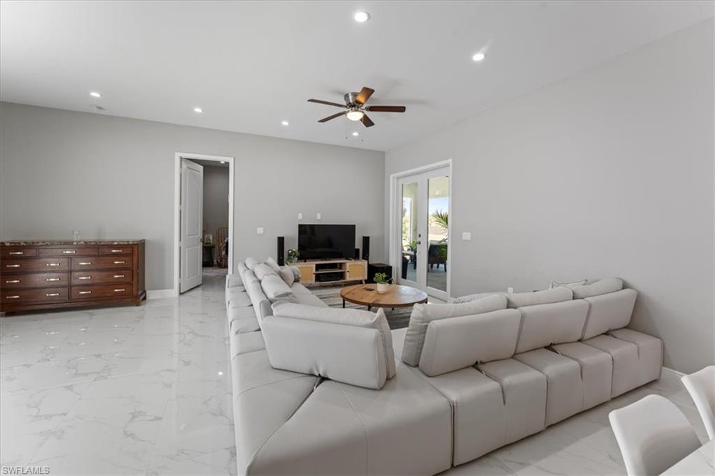 3219 64th Avenue Northeast Naples, FL 34120 - Photo 5 of 33 Living room with a ceiling fan, recessed lighting, marble finish floor, and baseboards
