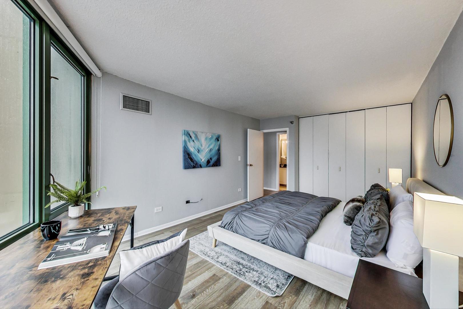 111 West Maple Street, Unit 3005 Chicago, IL 60610 - Photo 11 of 18 a living room with furniture