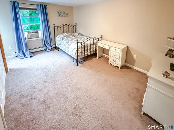 a bedroom with a bed and a cabinets