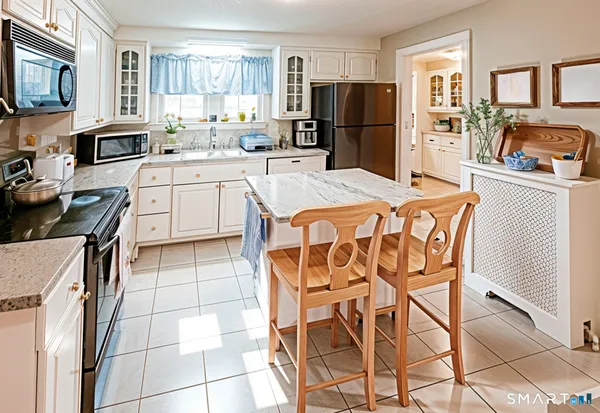 a kitchen filled with stainless steel appliances cabinets and a counter top space