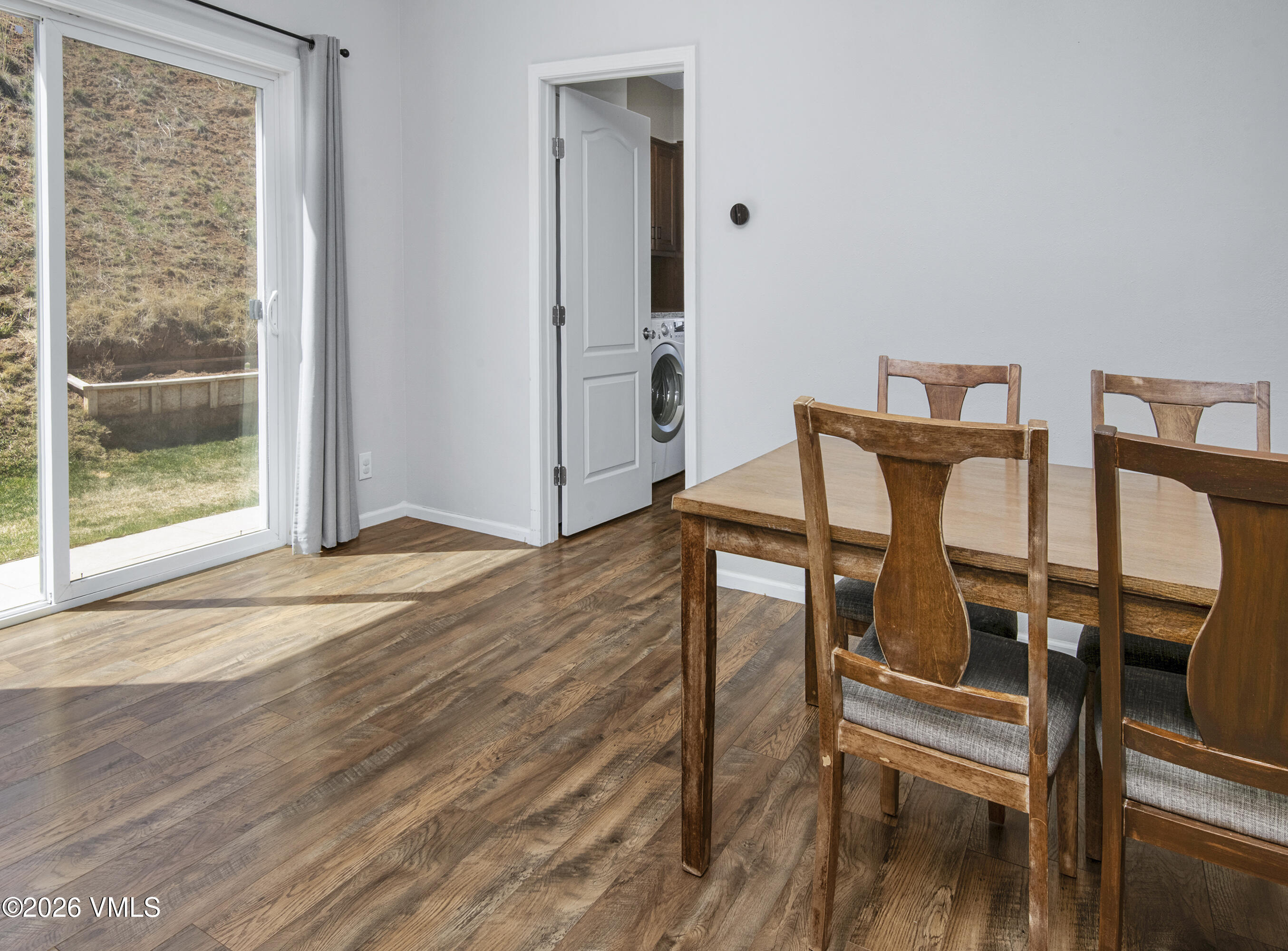 67 Maverick Court Gypsum, CO 81637 - Photo 11 of 40 a view of a room with wooden floor table and chairs