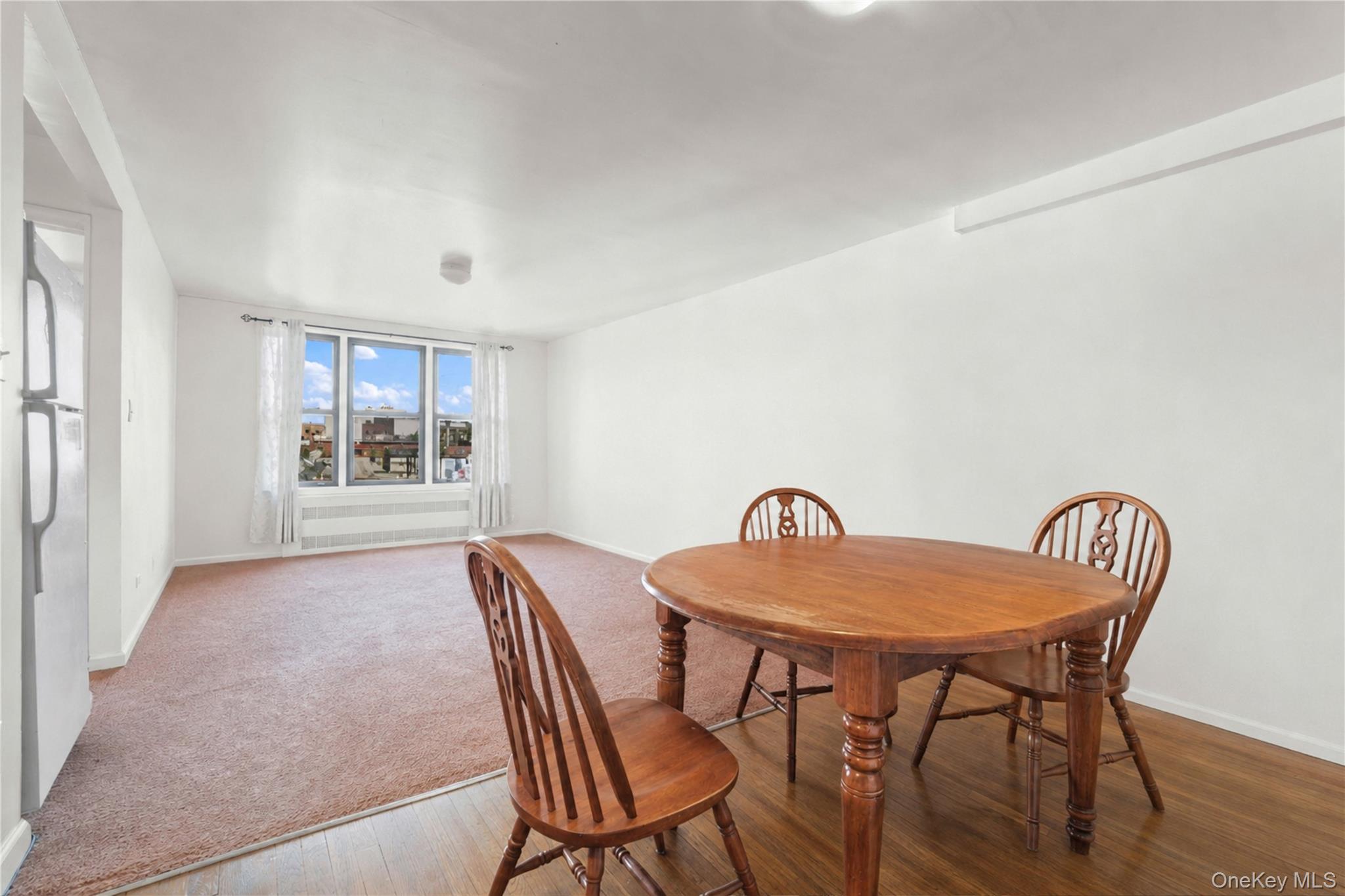 58-03 Calloway Street, Unit 5A Queens, NY 11368 - Photo 4 of 19 a view of a dining room with furniture and window