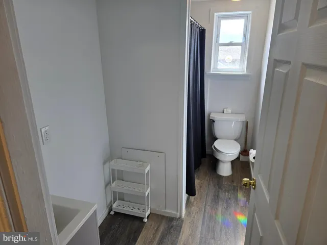 a bathroom with a toilet and a sink