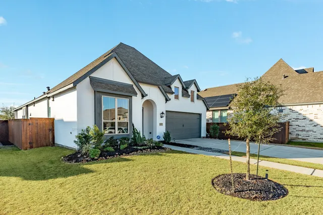a house with swimming pool in front of it