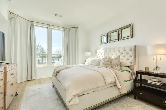 a bedroom with a bed and a cabinets