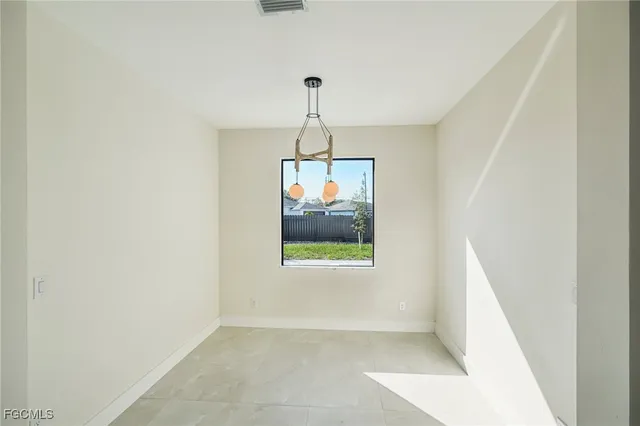 a view of a big room with carpet