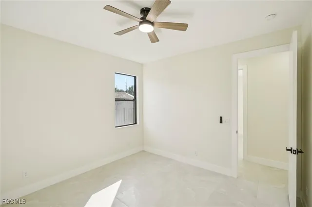 a view of a hallway with a ceiling fan
