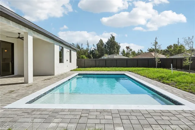 a view of house with yard and green space