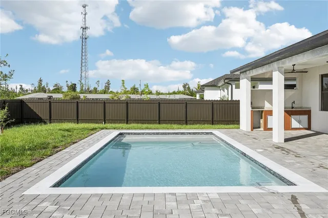 a view of a living room and a floor to ceiling window